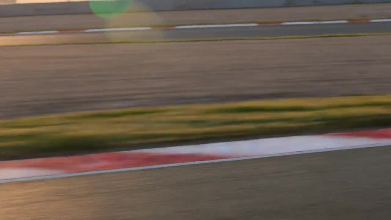 Low tracking shot speeding along a sunlit race track with heavy motion blur — a Kling 3.0 generation