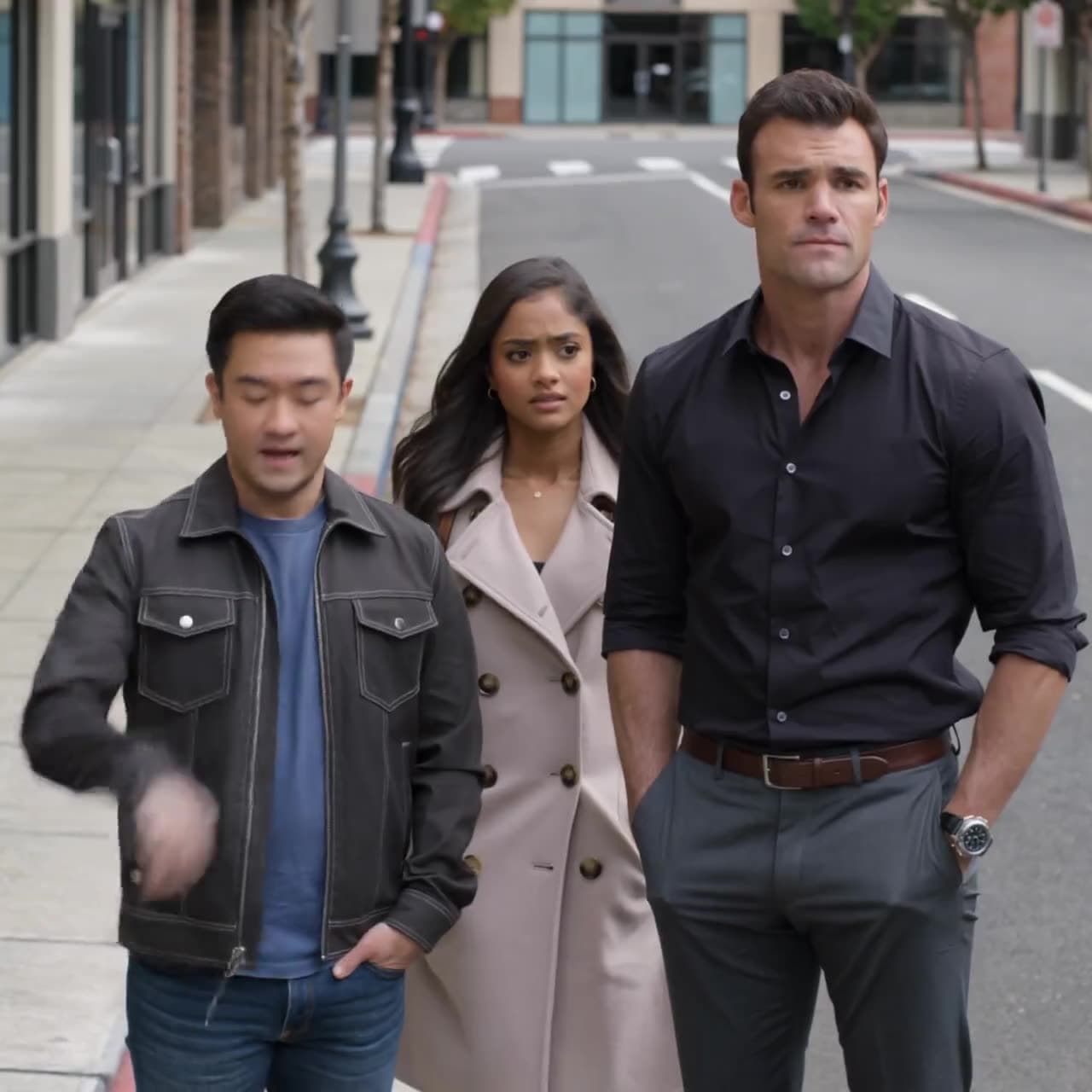 Three people walking toward camera down a city street under overcast light — a Kling 3.0 generation